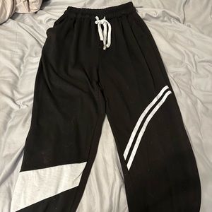 Thin black sweatpants with white stripes. Great condition.